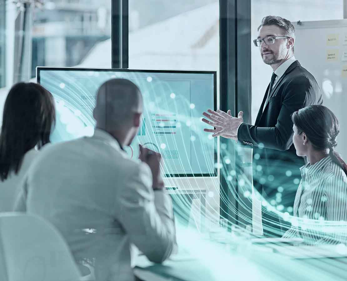 Executive presents at a meeting.